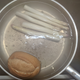 Asparagus and a bread roll.